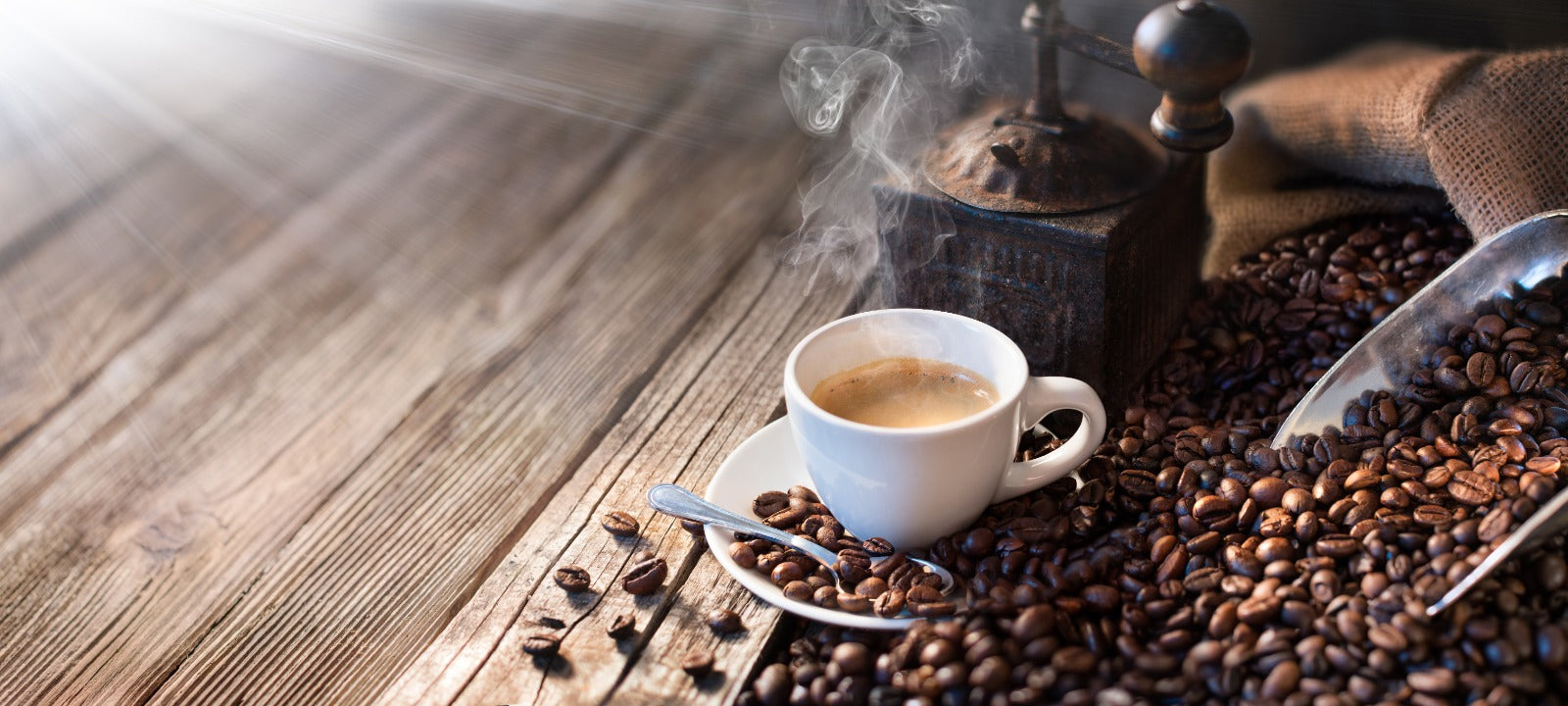 roasted coffee beans and cup of coffee