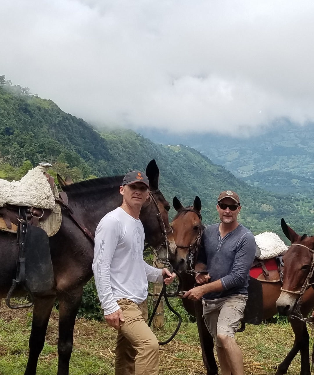 JR and George with horses in Colombia